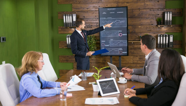 businessman-suit-having-presentation-with-charts-tv-screen-conference-rom-team-meeting